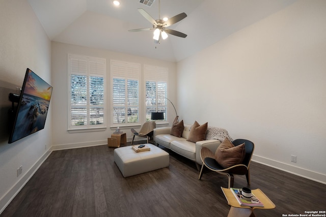 living room featuring lofted ceiling, ceiling fan, and dark hardwood / wood-style flooring