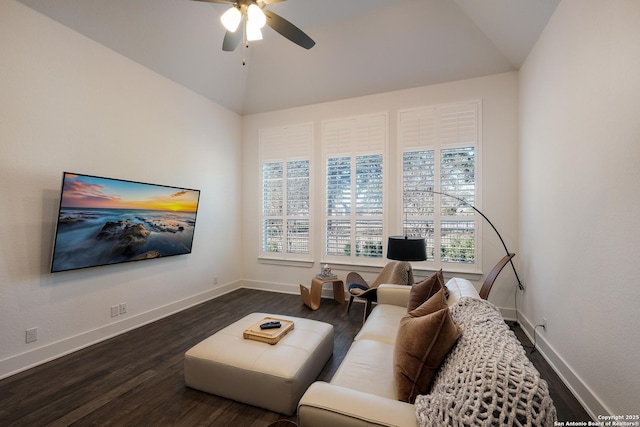 living room featuring ceiling fan, vaulted ceiling, and dark hardwood / wood-style flooring