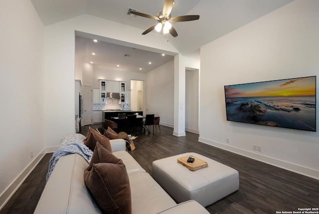 living room with ceiling fan, dark hardwood / wood-style flooring, and lofted ceiling