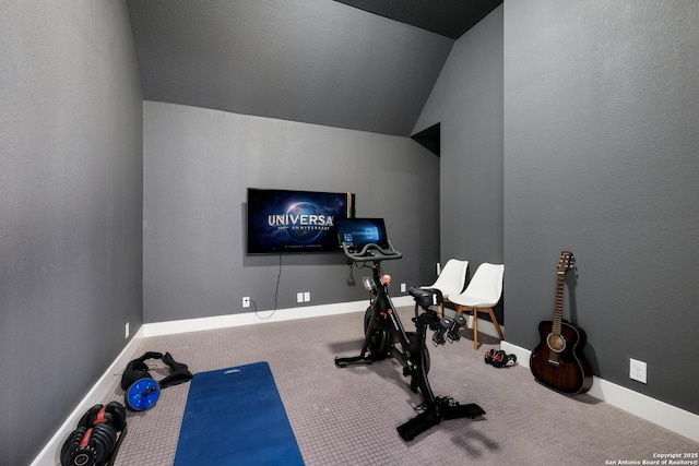 workout room with carpet and vaulted ceiling