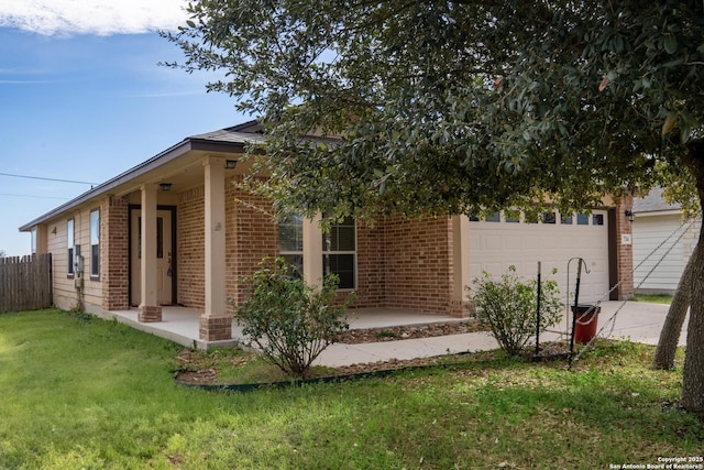 view of front of property with a garage and a front yard