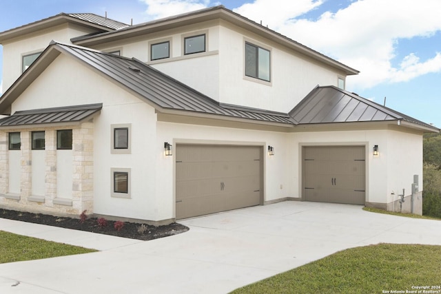 view of front of property featuring a garage