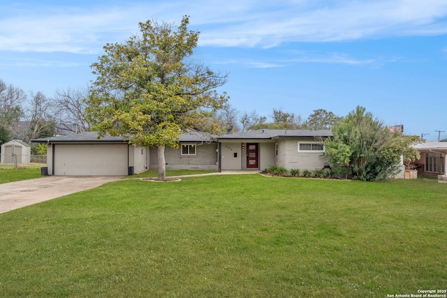 ranch-style house featuring a front yard and a garage