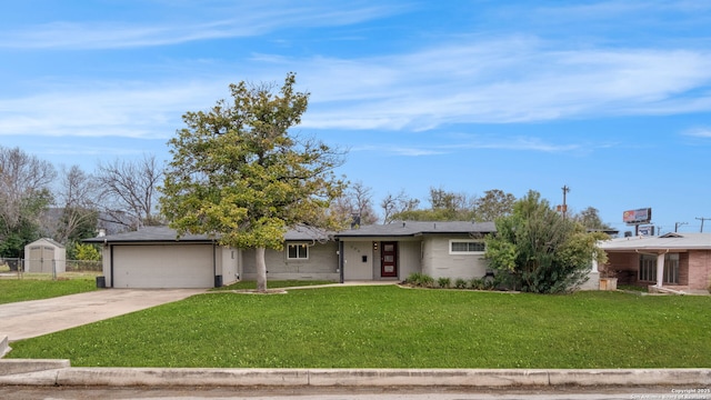 single story home with a front yard and a garage