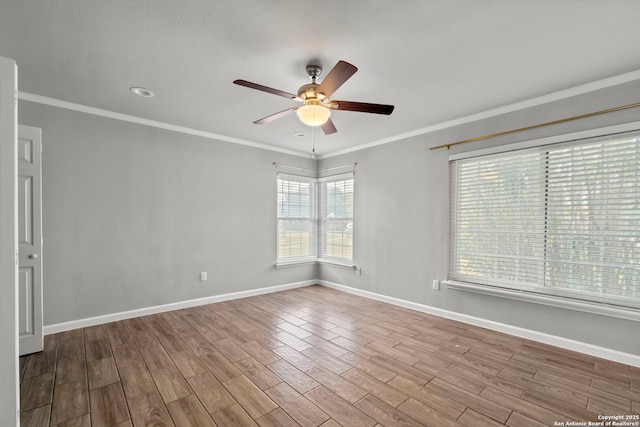 spare room with ceiling fan and ornamental molding