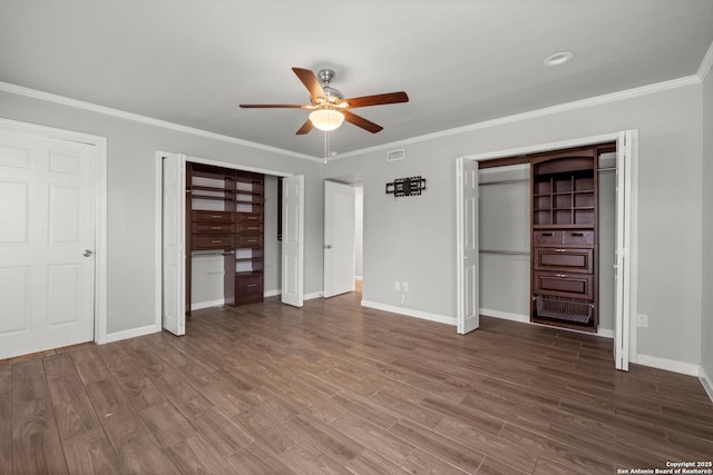 unfurnished bedroom with ceiling fan, dark hardwood / wood-style flooring, and crown molding