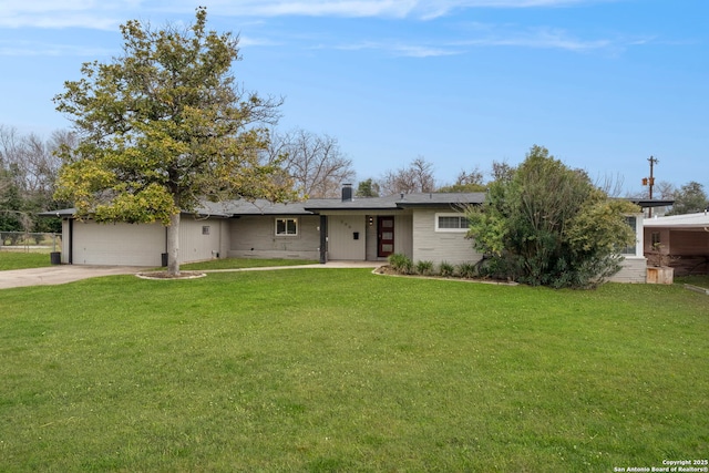 ranch-style home with a front yard and a garage