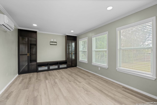 unfurnished living room with light wood-type flooring, ornamental molding, and a wall mounted air conditioner