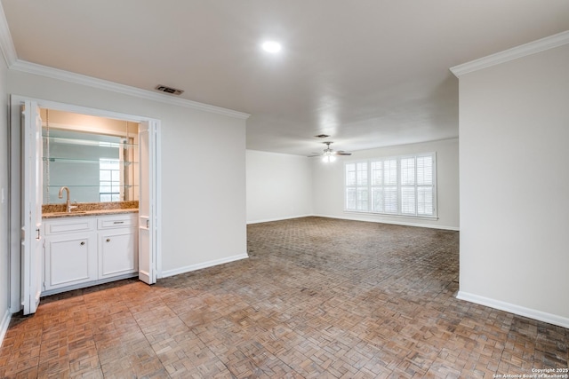 7926 Broadway Unit 402, San Antonio, TX 78209 - unfurnished living room with ceiling fan, sink, and crown molding