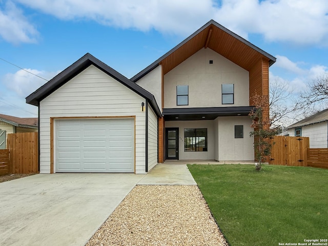 view of front of home with a garage and a front lawn