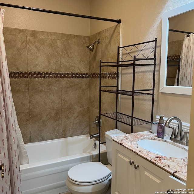 full bathroom with vanity, toilet, and shower / tub combo