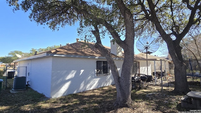 view of home's exterior with central AC