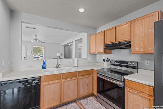 kitchen with ceiling fan, appliances with stainless steel finishes, light brown cabinetry, a textured ceiling, and sink