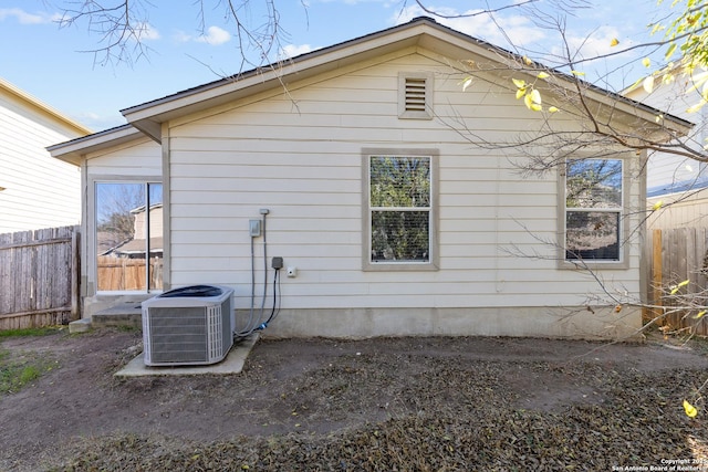 view of property exterior with central AC unit