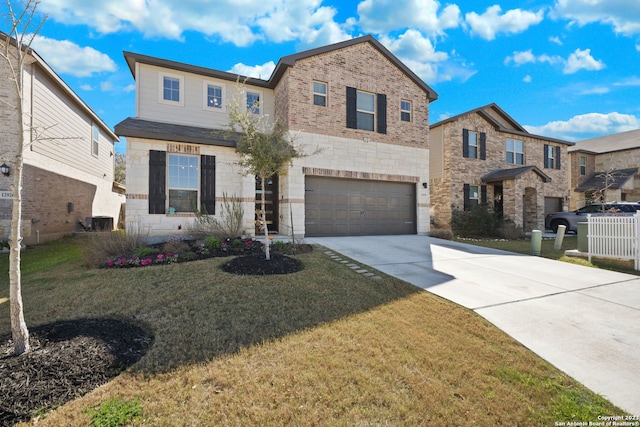 view of front facade featuring a front lawn, cooling unit, and a garage