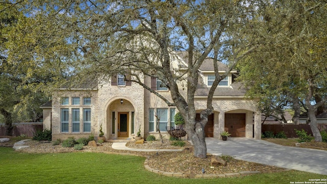 view of front facade with a garage and a front lawn