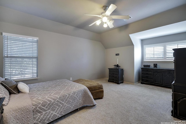 bedroom featuring ceiling fan, lofted ceiling, and light carpet