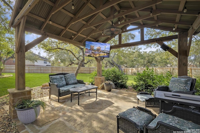 view of patio / terrace with a gazebo, ceiling fan, and an outdoor hangout area