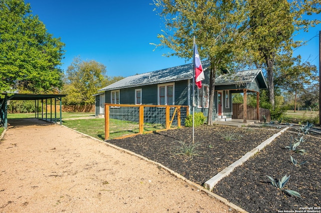 exterior space with a carport