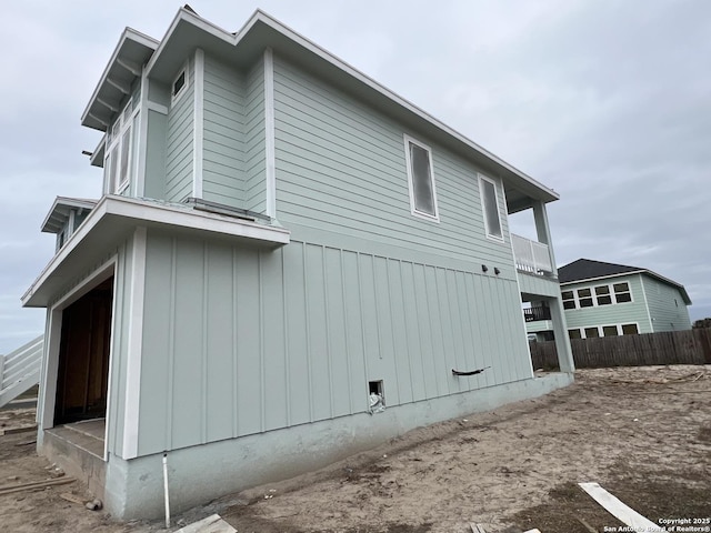 view of home's exterior with a balcony