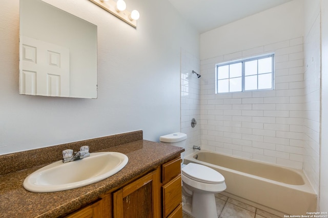 full bathroom featuring toilet, tile patterned flooring, tiled shower / bath combo, and vanity