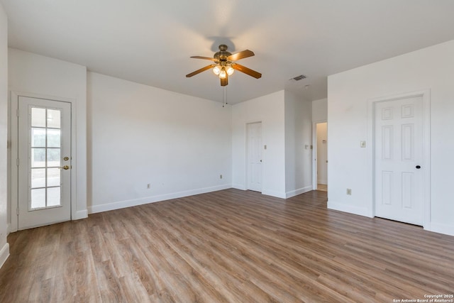 interior space with ceiling fan and light hardwood / wood-style flooring