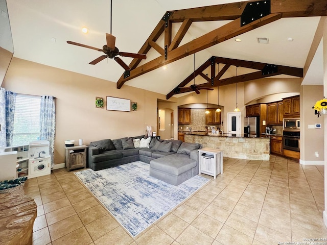 tiled living room with high vaulted ceiling, beam ceiling, and ceiling fan