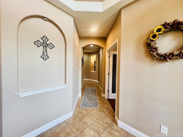 corridor with tile patterned flooring