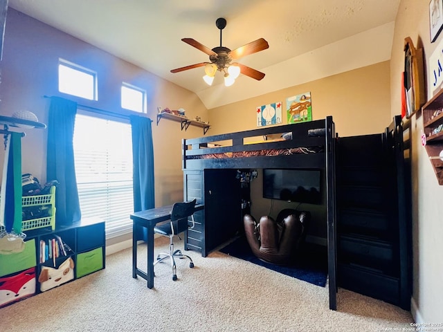 carpeted bedroom featuring vaulted ceiling and ceiling fan