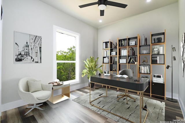 office area with wood finished floors, baseboards, and ceiling fan