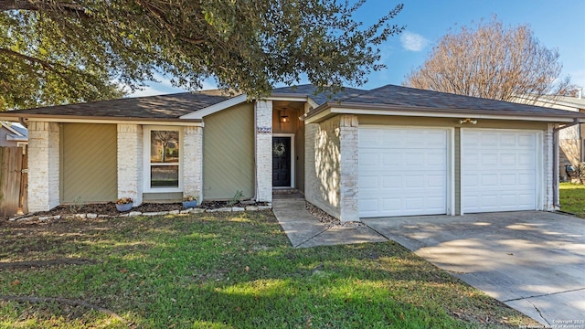 ranch-style home with a front lawn and a garage