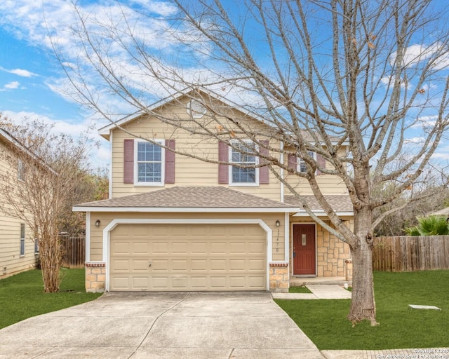 front facade featuring a garage and a front lawn