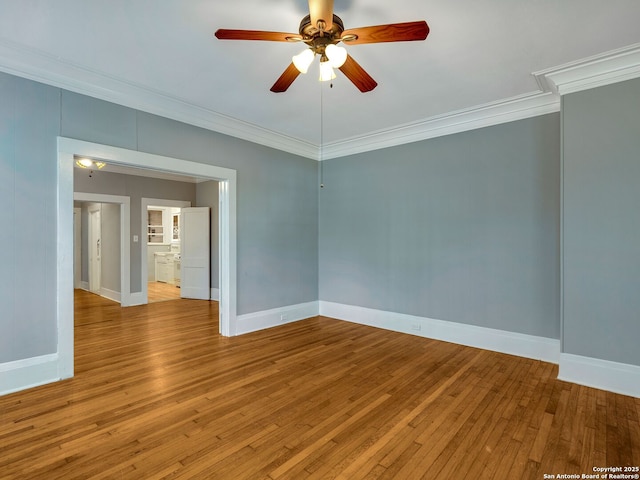 unfurnished room featuring ceiling fan, ornamental molding, and light wood-type flooring