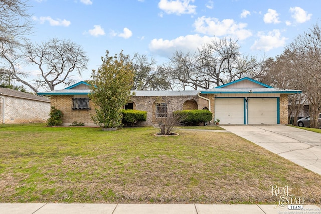 single story home with a garage and a front lawn