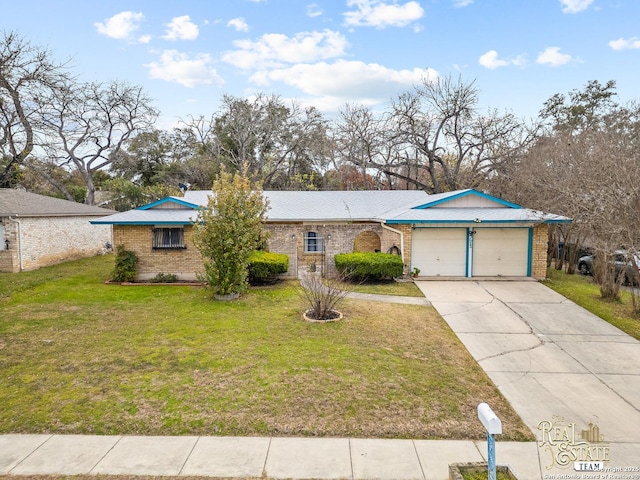 ranch-style house with a garage and a front lawn