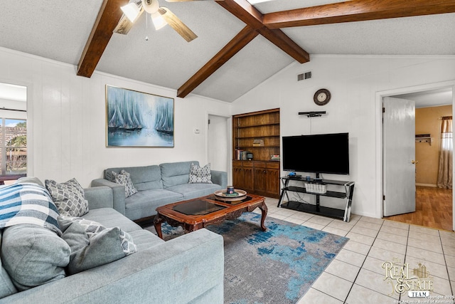 tiled living room featuring a textured ceiling, ceiling fan, vaulted ceiling, and built in features