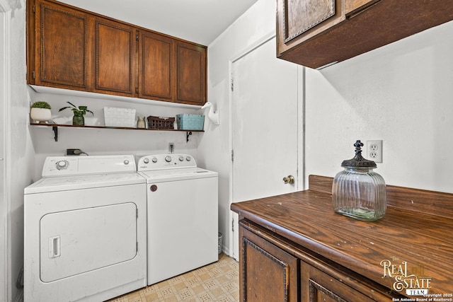 clothes washing area with independent washer and dryer and cabinets