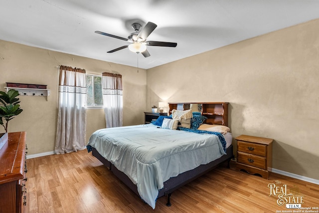 bedroom with ceiling fan and hardwood / wood-style flooring