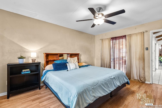 bedroom featuring ceiling fan and hardwood / wood-style flooring