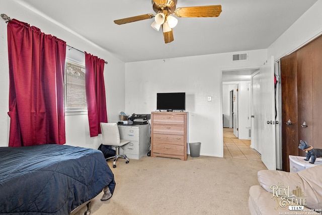 bedroom featuring ceiling fan and light colored carpet