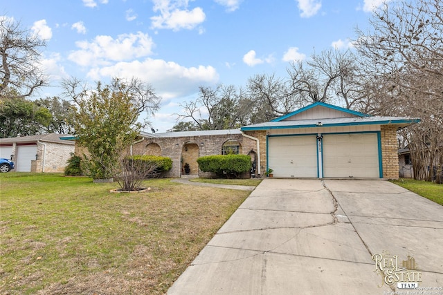 ranch-style home featuring a garage and a front yard