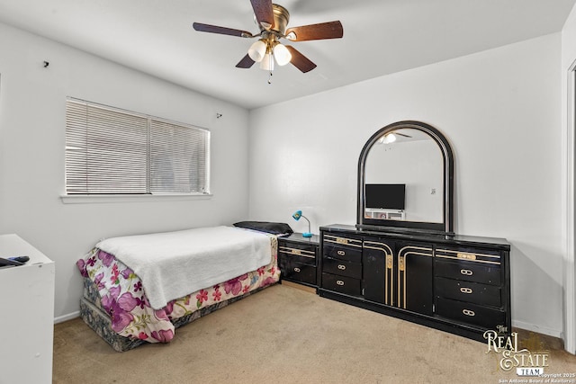 bedroom with ceiling fan and carpet flooring