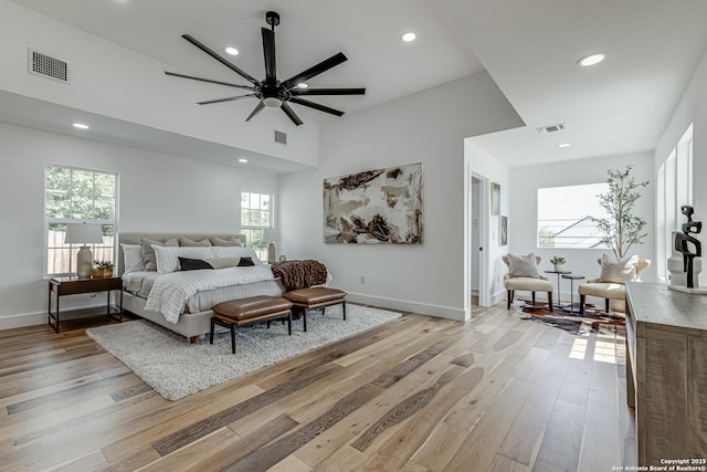 bedroom with ceiling fan and light hardwood / wood-style floors