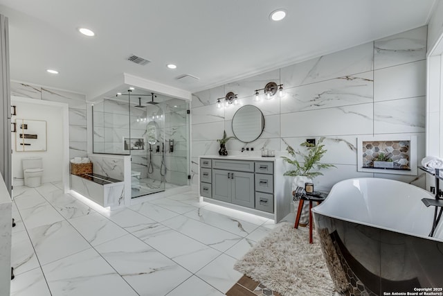 full bathroom with toilet, independent shower and bath, tile walls, and vanity