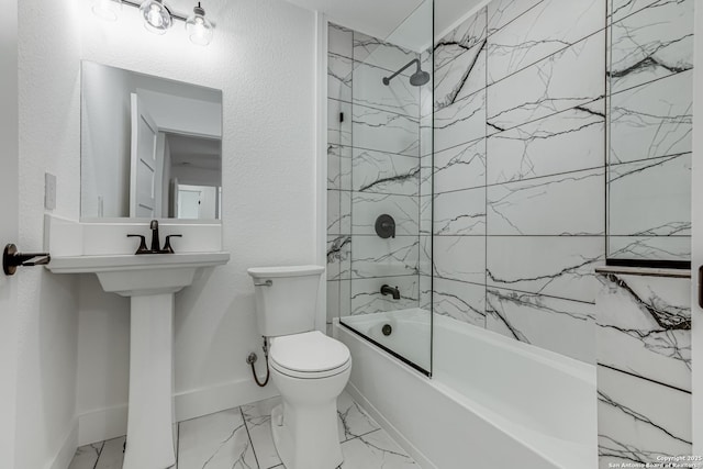 bathroom with toilet and tiled shower / bath combo