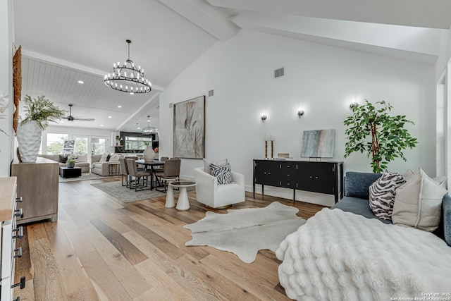 living room featuring ceiling fan with notable chandelier, light hardwood / wood-style floors, high vaulted ceiling, and beamed ceiling