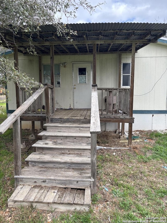 doorway to property with a porch