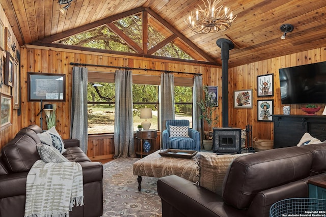 living room with lofted ceiling, a wood stove, and wooden walls