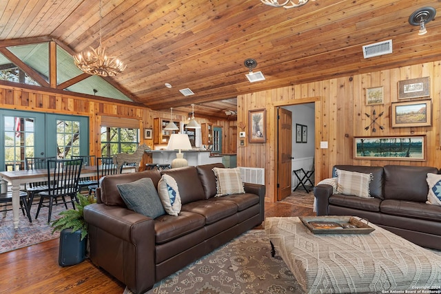 living room with wood ceiling, wooden walls, visible vents, and wood finished floors