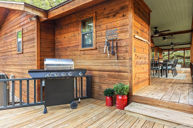 deck with a ceiling fan, outdoor dining area, and area for grilling